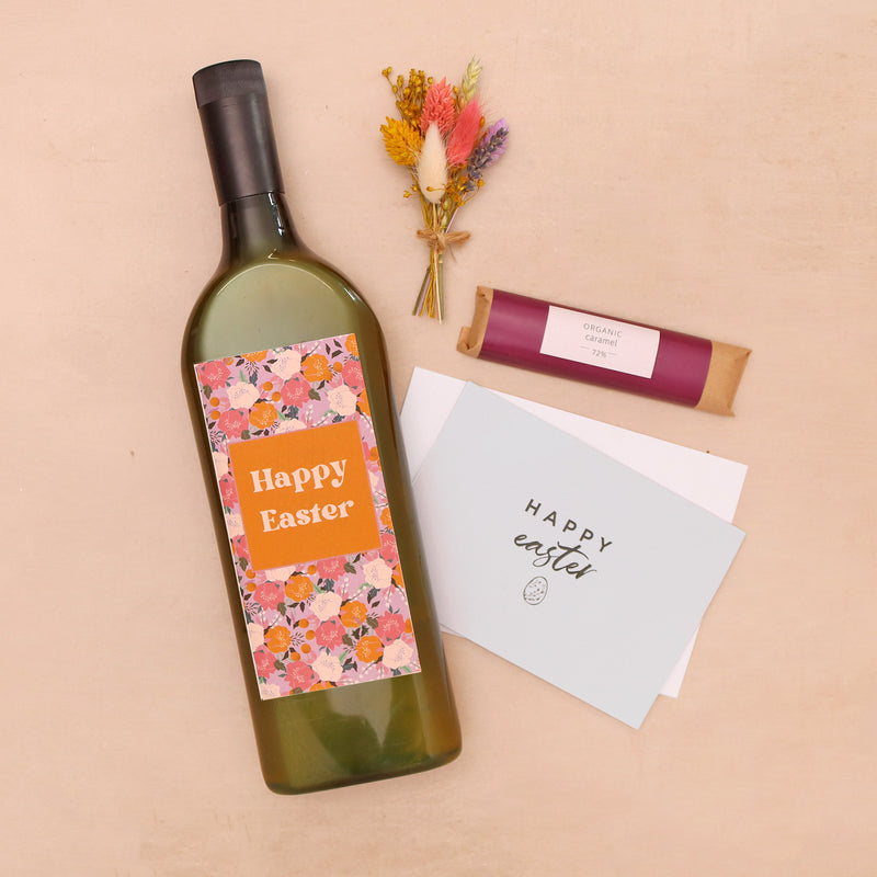 Letterbox wine with happy easter label, with mini pastel dried flower posy and sweet caramel chocolate bar