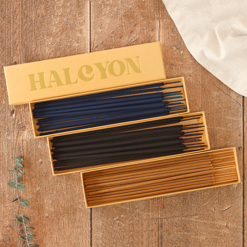Three yellow boxes containing fifteen incense sticks in each with Halcyon gold foil lid