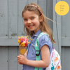 A child holding a bright summer dried flower posy with personalised teacher's name sticker