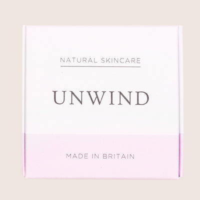 Unwind bath bomb in white and pink cardboard box