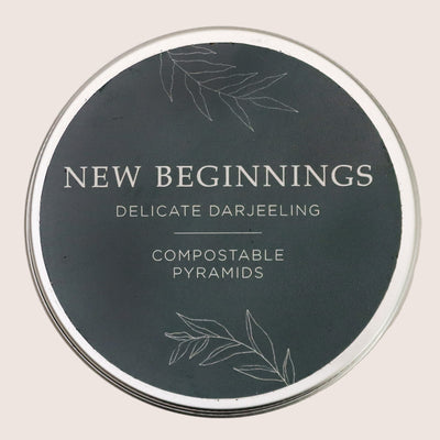 New Beginnings tea tin containing darjeeling tea pyramids