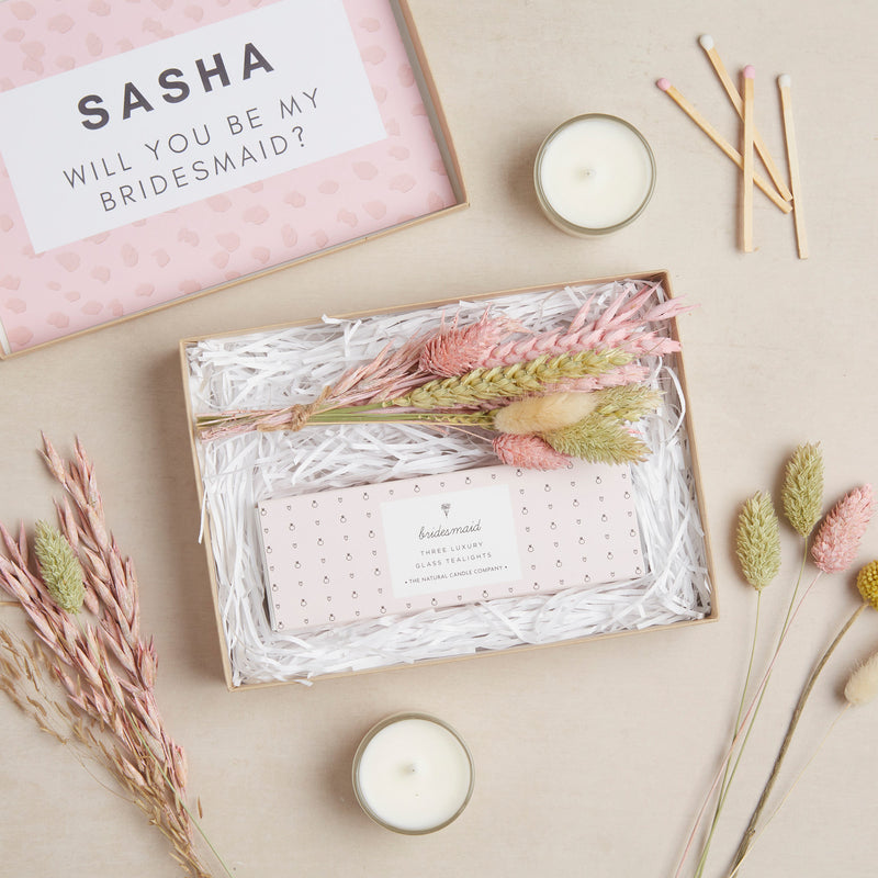 Mini letterbox gift set in kraft box, containing bridesmaid tealights & pastel pink dried flower posy with personalised box lid stating 'will you be my bridesmaid?'