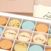 Fifteen Orange, green and cream macarons in a letterbox-friendly gift box with a Happy Fathers day greetings card