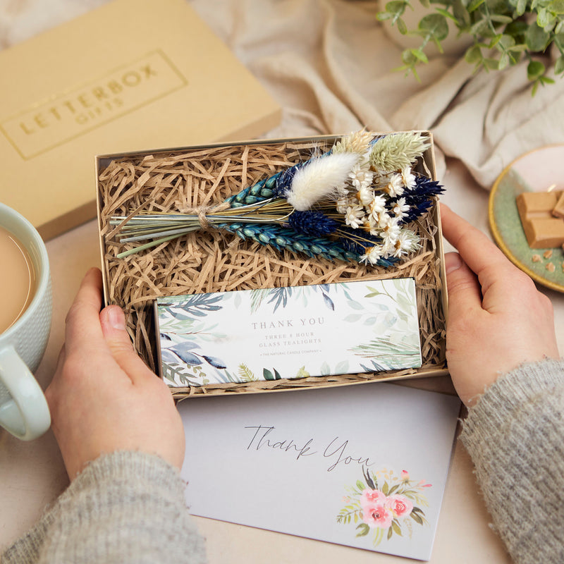 Mini thank you gift set containing thank you tealights and blue & white dried flower posy in a kraft box