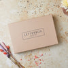 Tan brown gift set with 'letterbox gifts' text on the lid