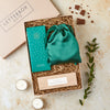 Letterbox-friendly gift set containing green silk eye mask, cocktail chocolate bar and black pomegranate tealights
