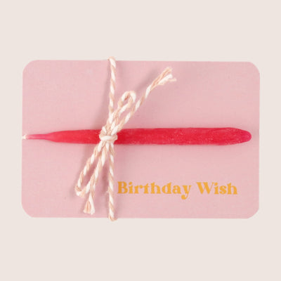 Pink beeswax teardrop candle on a pink 'birthday wish' card, tied with pink string bow