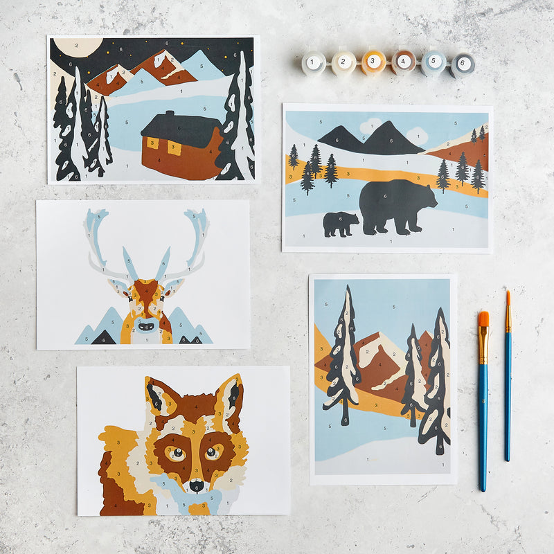 Winter paint by numbers images including cottage, reindeer, fox, snowy trees and bears