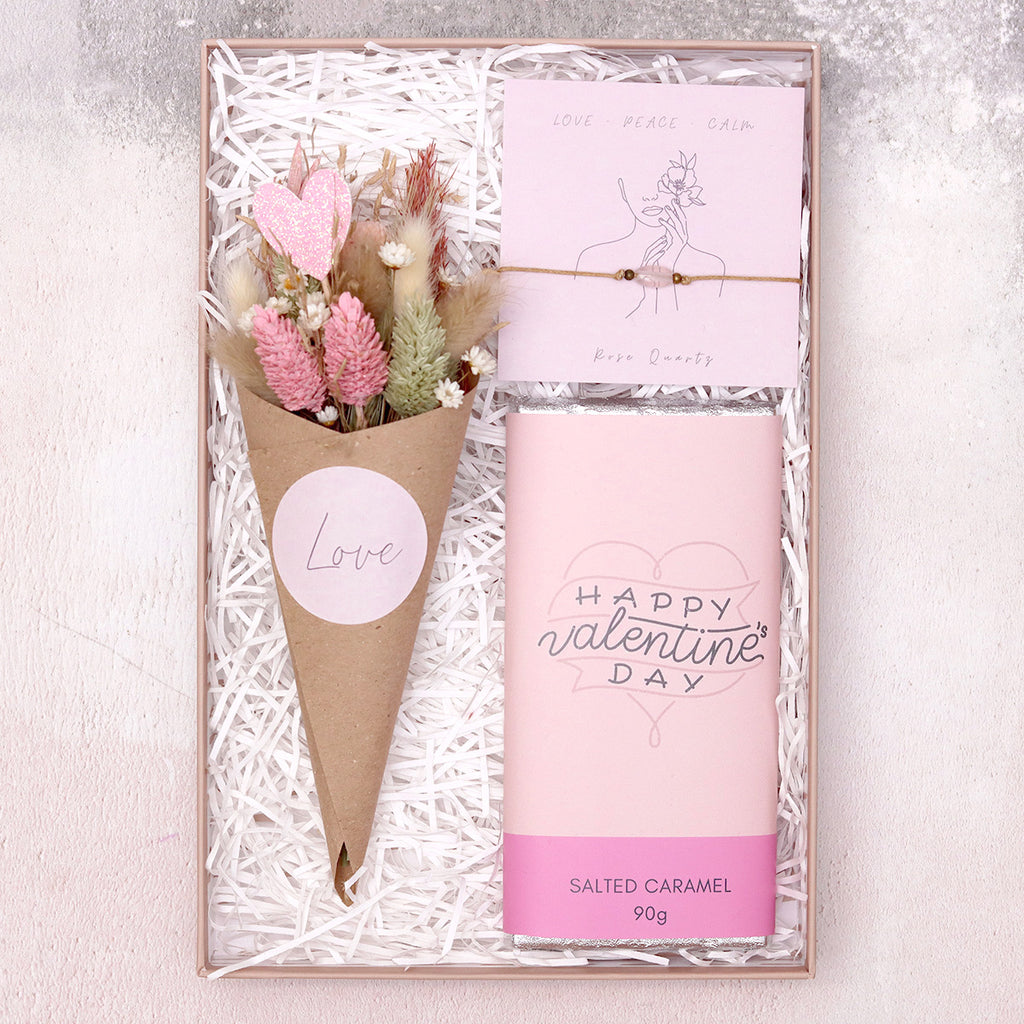 Valentine's floral gift set containing happy valentine's day salted caramel chocolate bar, rose quartz gemstone bracelet & pink and white dried flower posy with 'love' sticker