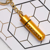 Close-up of the gold beevive bee revival kit on a keyring