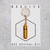 Gold Beevive bee revival kit on a keyring
