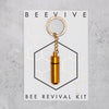 Gold Beevive bee revival kit on a keyring