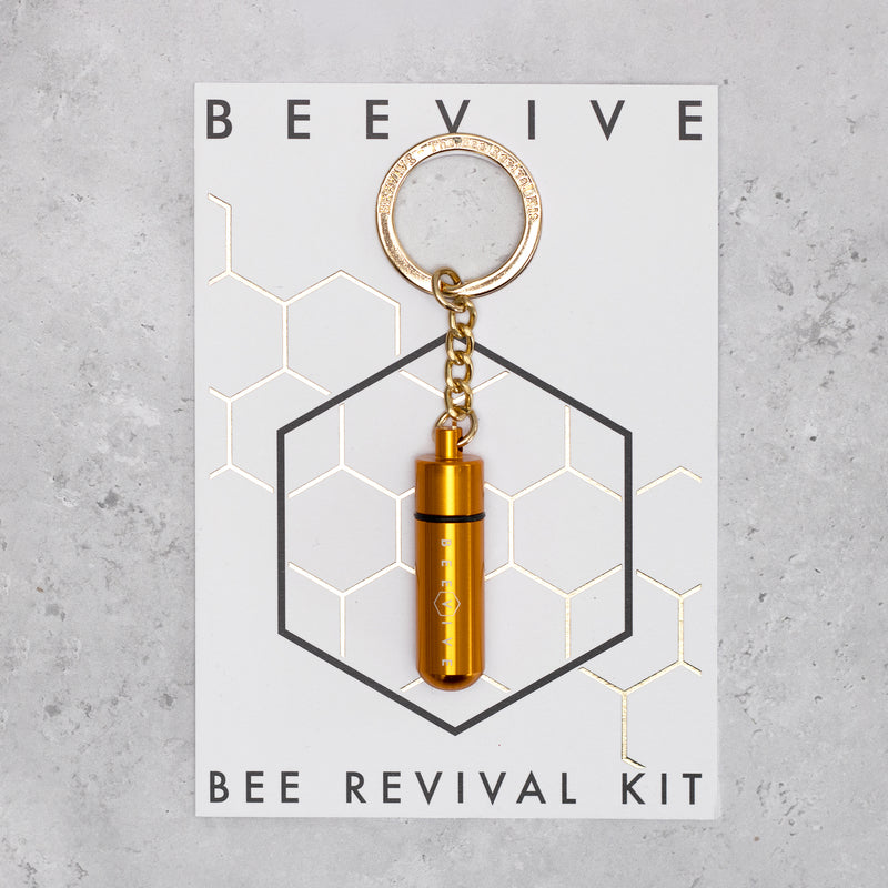 Gold Beevive bee revival kit on a keyring