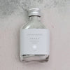 Awake charcoal detox face mask in a glass bottle