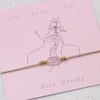 Rose quartz gemstone bracelet on pale pink card detailing the qualities love, peace and calm