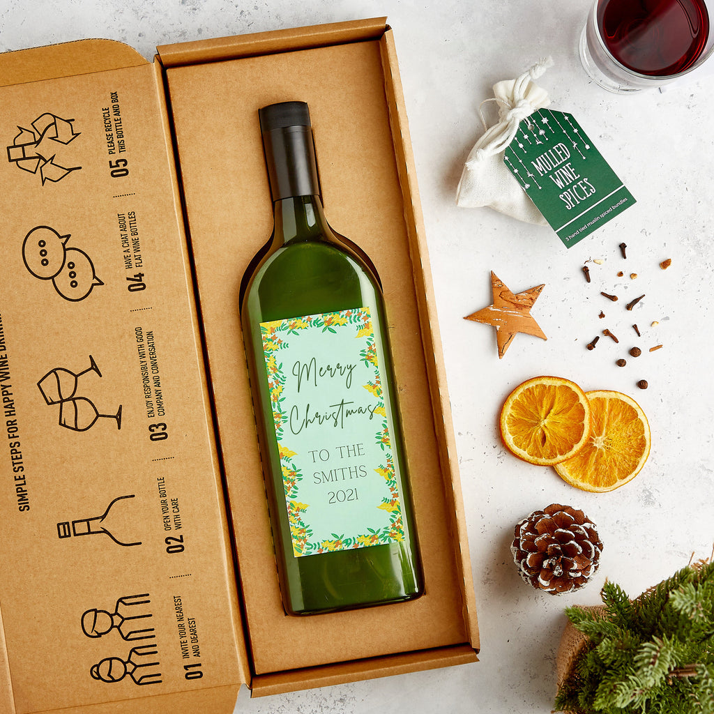 Letterbox-friendly red wine bottle with mulled wine spices pouch and personalised merry christmas wine label