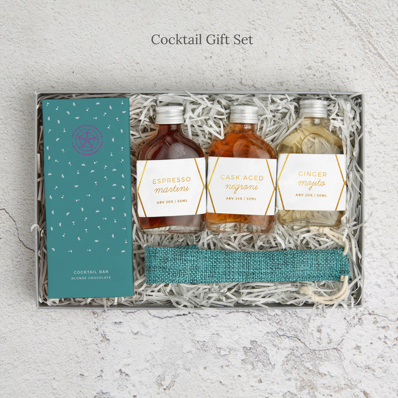 The 'Cocktail' Letterbox Gift set containing three pre-mixed cocktails in glass bottles, bamboo straw and cocktail chocolate bar