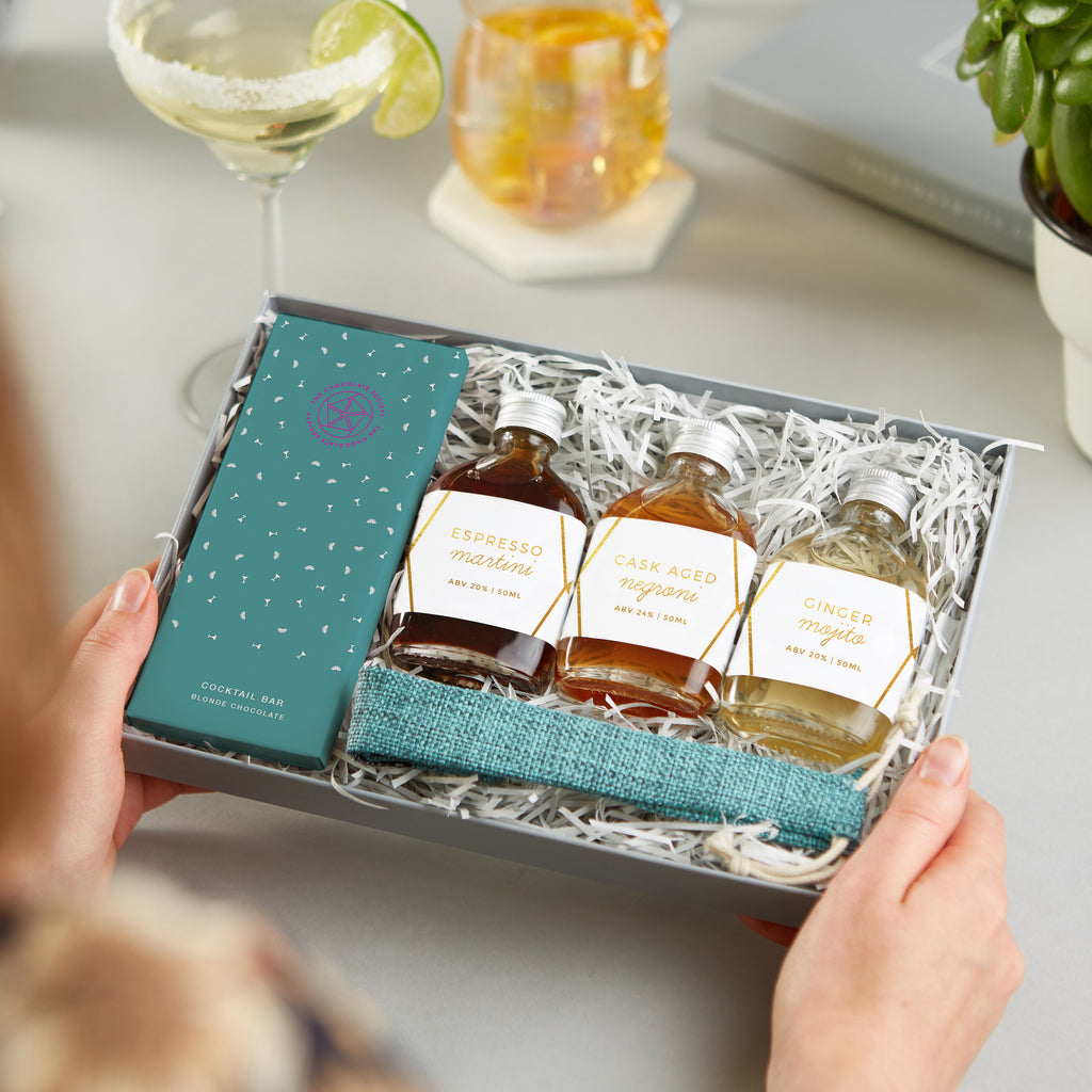 The 'Cocktail' Letterbox Gift set containing three cocktail miniatures, gin & tonic chocolate bar and bamboo straw