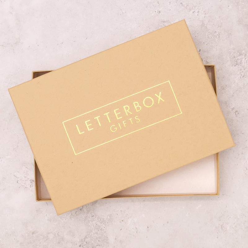 Yellow kraft gift box with 'letterbox gifts' gold foiling
