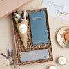 Thinking of You letterbox gift set containing salted caramel chocolate bar, thinking of you tealights & blue dried flower posy