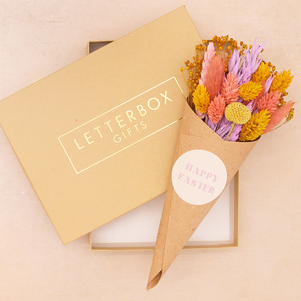 Pink, purple and yellow pastel dried flower posy in kraft cone with happy easter sticker in a letterbox gifts kraft gift box