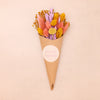Pink, purple and yellow pastel dried flower posy in kraft cone with happy easter sticker