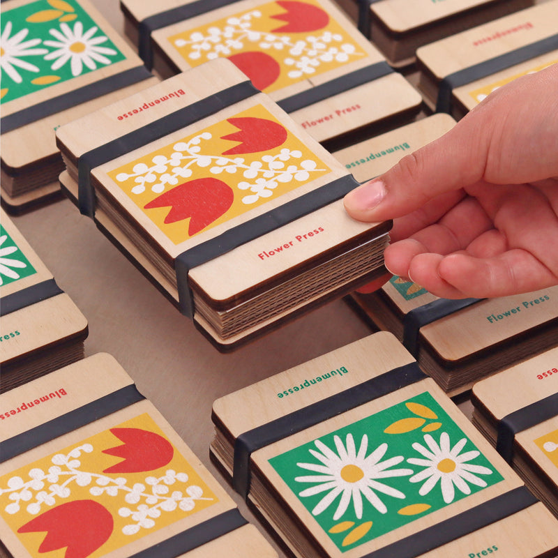 Wooden flower press gift sets on a table