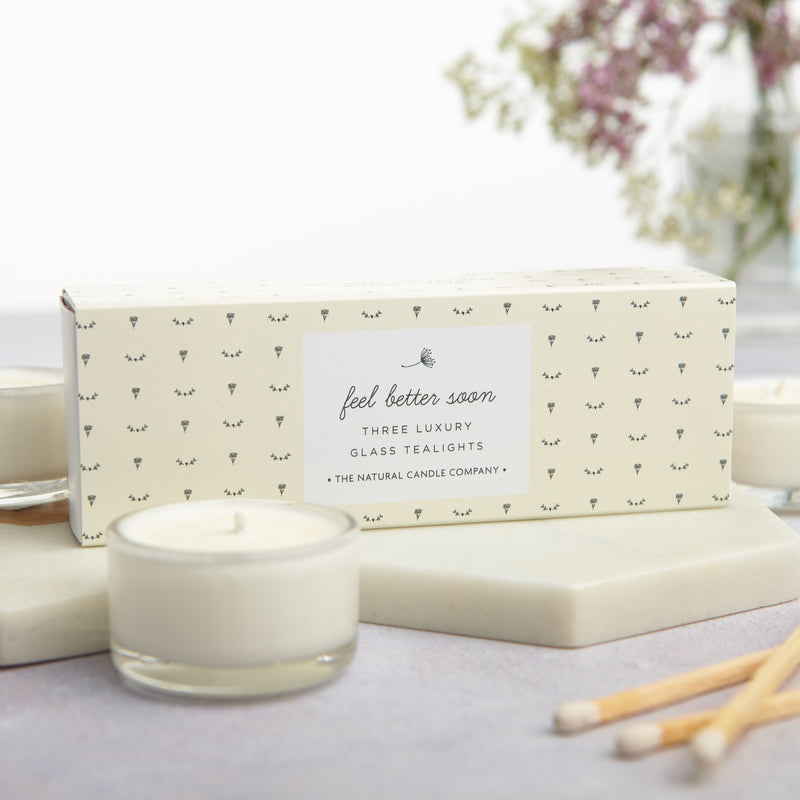 Three luxury glass tealights in a pale yellow 'Feel Better Soon' box