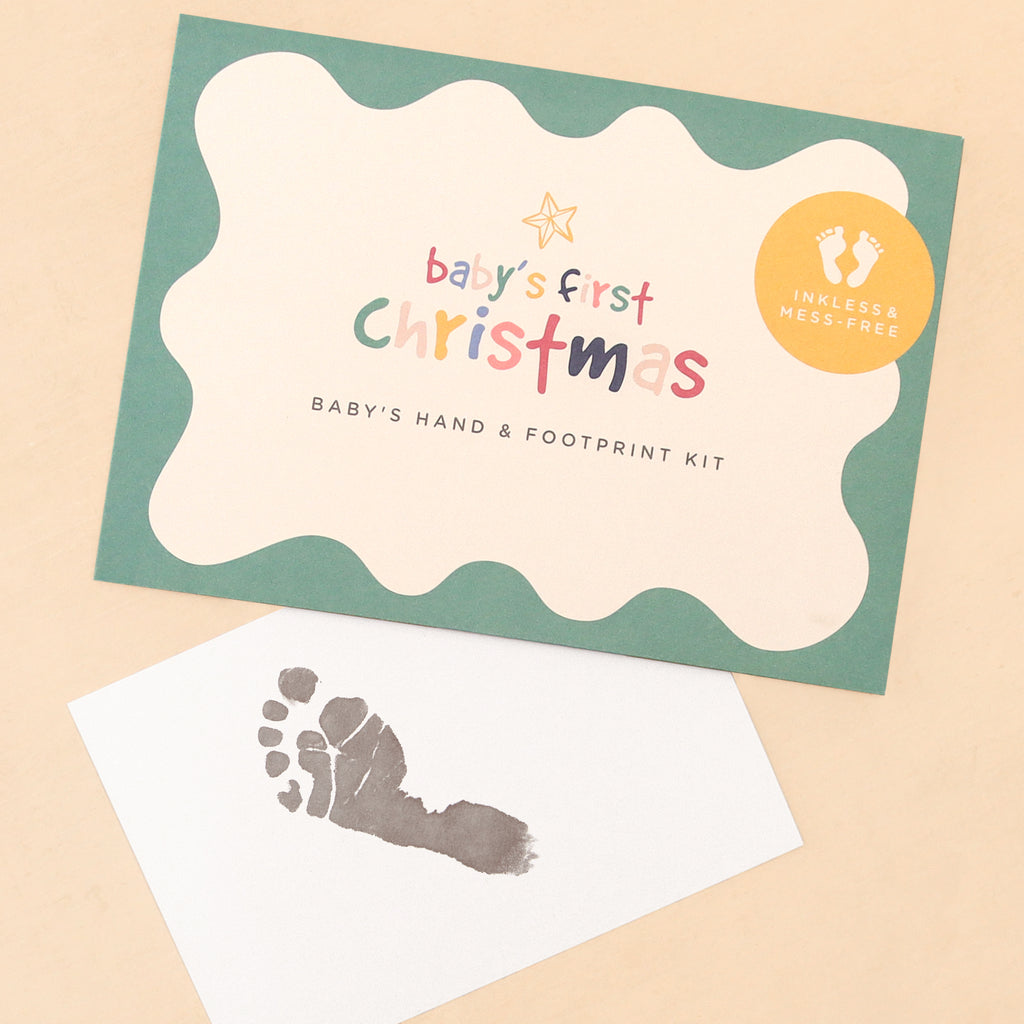 Baby's First Christmas hand & footprint kit in green scallop-edged envelope