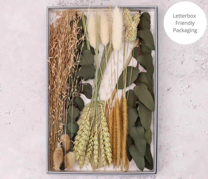 Natural green, white and brown dried flower bouquet arranged in letterbox-friendly gift box