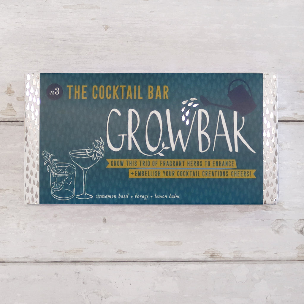 Letterbox-friendly cocktail grow bar containing cinnamon basil, borage and lemon balm seeds in dark green packaging
