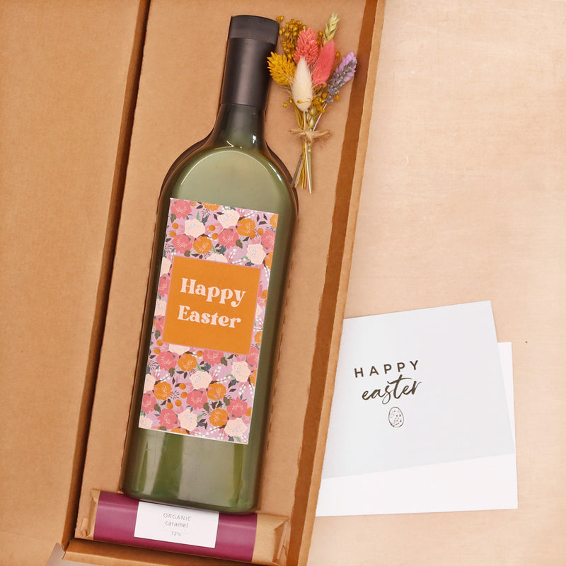 Letterbox wine with happy easter label, with mini pastel dried flower posy and sweet caramel chocolate bar