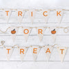 Trick or treat halloween bunting triangles in orange and white