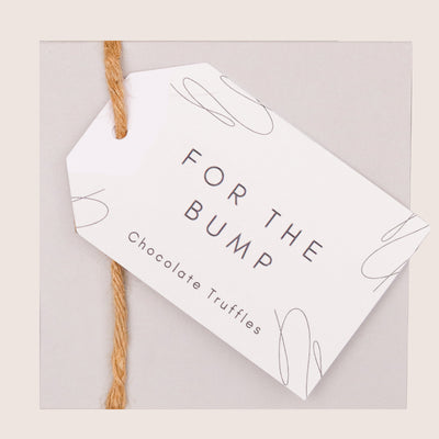 Butterscotch chocolate truffles in grey box with 'for the bump' pregnancy swing tag