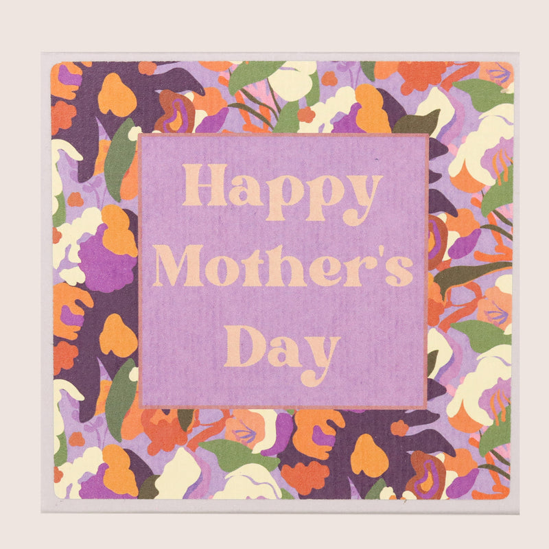 Butterscotch truffles in square box with a 'happy mother's day' purple and orange sticker