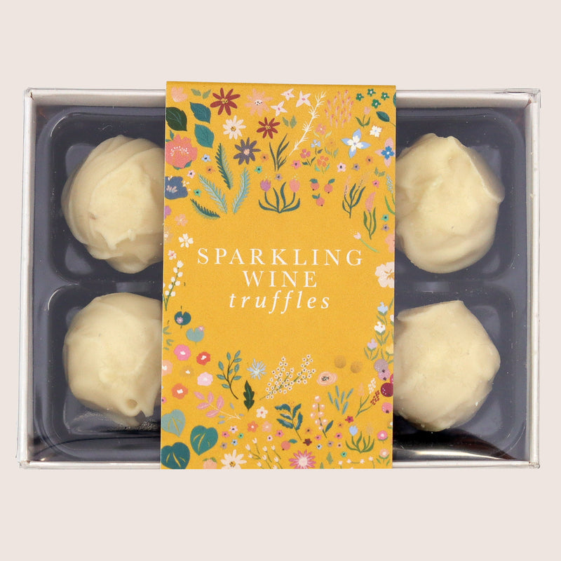 Six sparkling wine chocolate truffles with yellow botanical sleeve