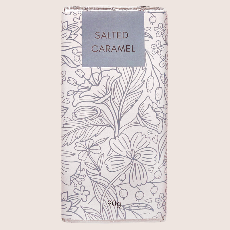 Salted caramel chocolate bar in blue and white wrapper with flower outline