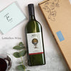 Letterbox-friendly red wine bottle next to a 'flat' letterbox-friendly gift box and just for you greetings card