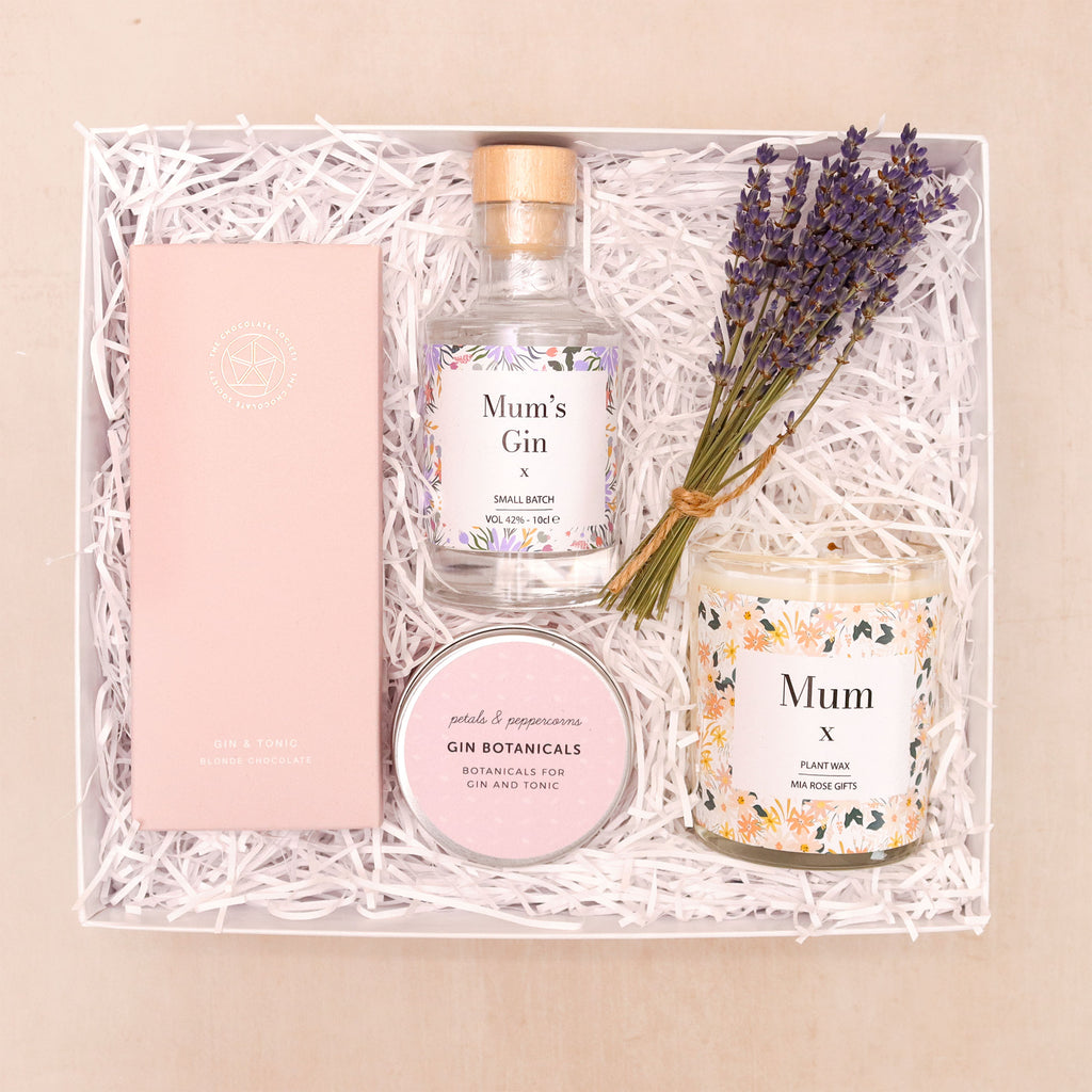 Mum's Luxury Gin Hamper containing 'mum's gin' miniature bottle, 'mum' candle, gin botanicals, lavender bunch & gin & tonic chocolate bar, in white gift box with shredded straw