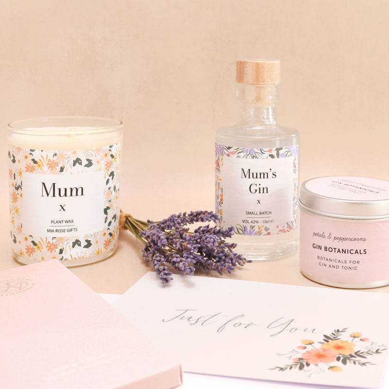 Individual items of luxury mum's gin gift hamper - mum's gin bottle, gin botanicals, mum candle, lavender bunch
