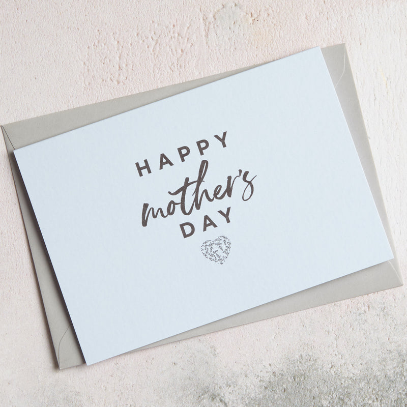 a light blue Happy Mother's Day card with a heart icon placed on a grey envelope