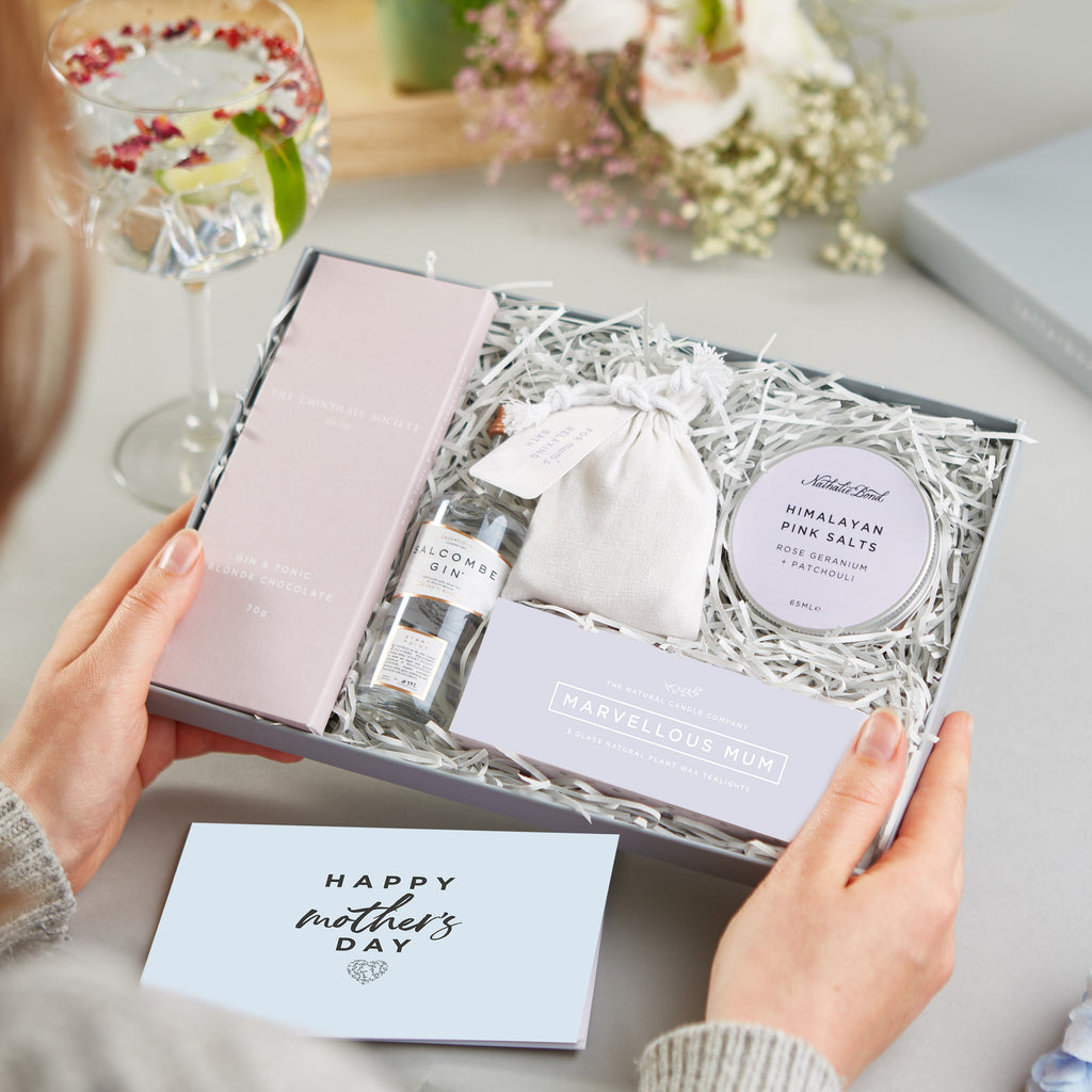 a mum receiving a 'Mum's Gin night in' Letterbox Gift and a mother's day card