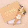 Neutral green & white dried flower posy with 'mum to be' sticker in a mini kraft gift box