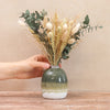 Neutral-tone dried flower bouquet arranged in a green ombre vase