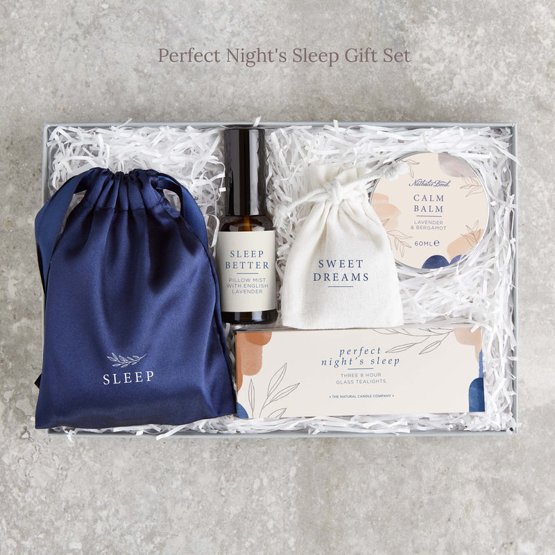 The 'Perfect Night's Sleep' gift set containing dark blue silk eye mask, pillow mist, calm balm, lavender pouch and tealights