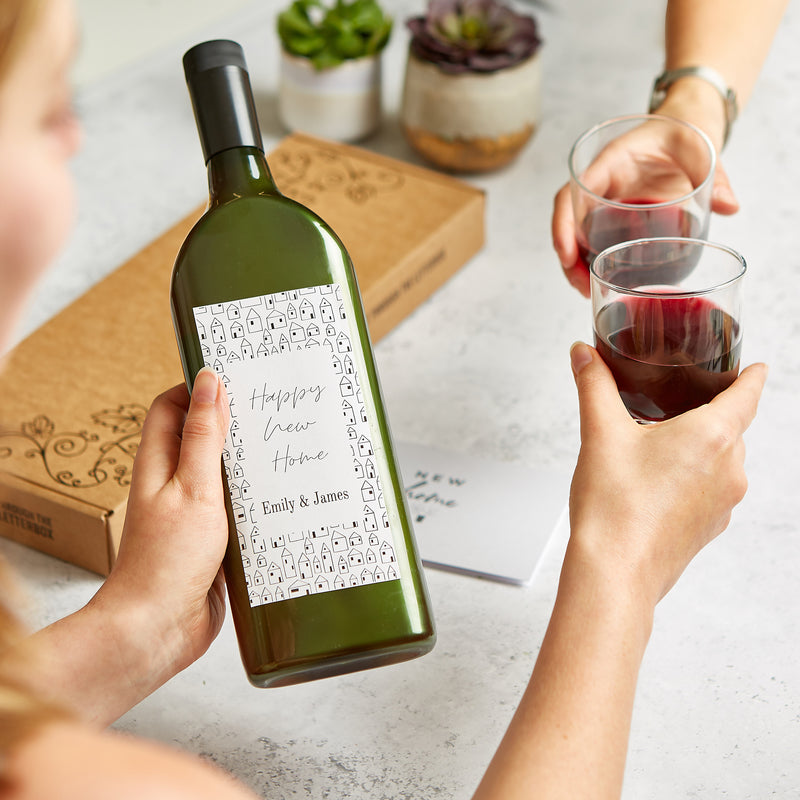 Letterbox-friendly wine bottle with personalised 'happy new home' wine label