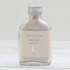 Relax red clay face mask in a glass bottle