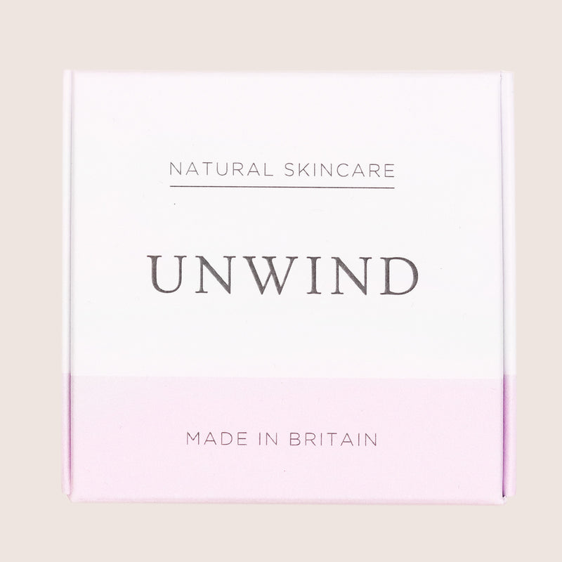 Unwind bath bomb in white and pink cardboard box