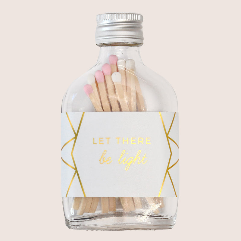 Pink and white tip birthday matches in glass bottle with 'let there be light' sticker