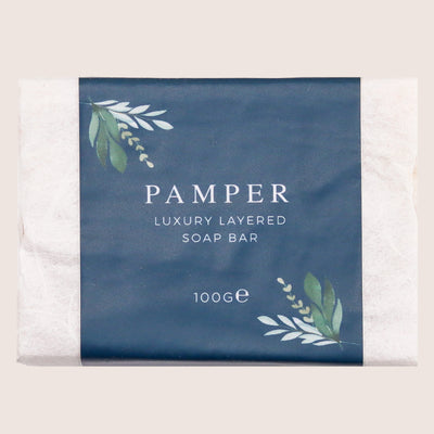 100g pamper luxury layered soap bar wrapped in tissue with blue leafy design